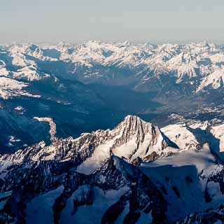 Aerial view of the Bietschhorn mountain and the Rhone valley behind