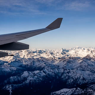 Aerial view of Matterhorn and Mont Blanc mountains in the Alps with wing