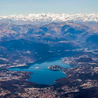 Aerial view of Lake Orta with Alps mountains from South