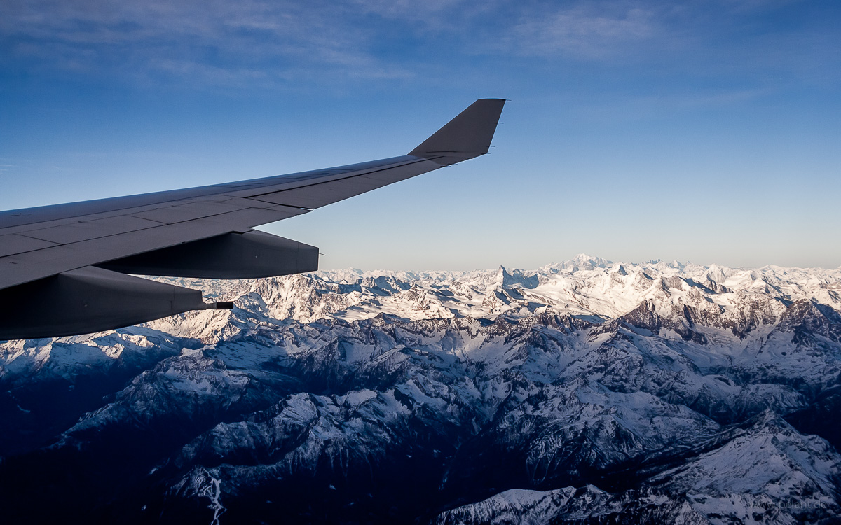 Aerial view of Matterhorn and Mont Blanc mountains in the Alps with wing