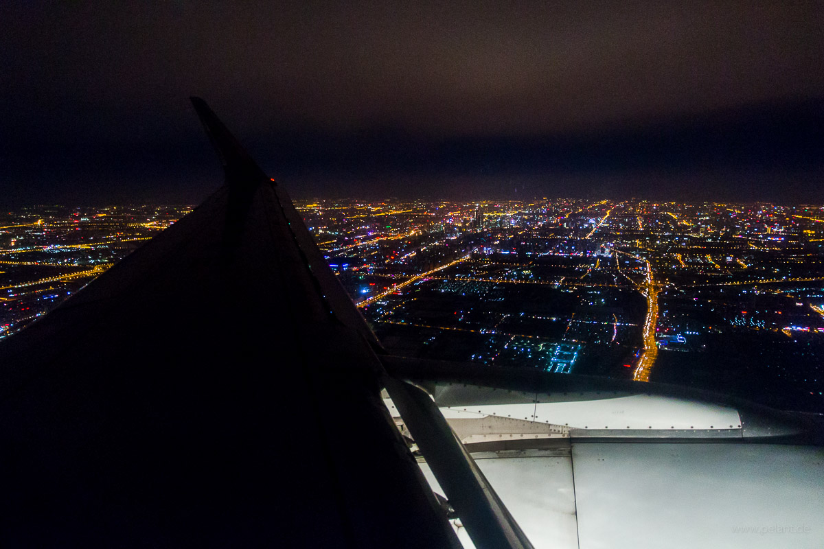 aerial view of Beijing at night from an airplane during final approach