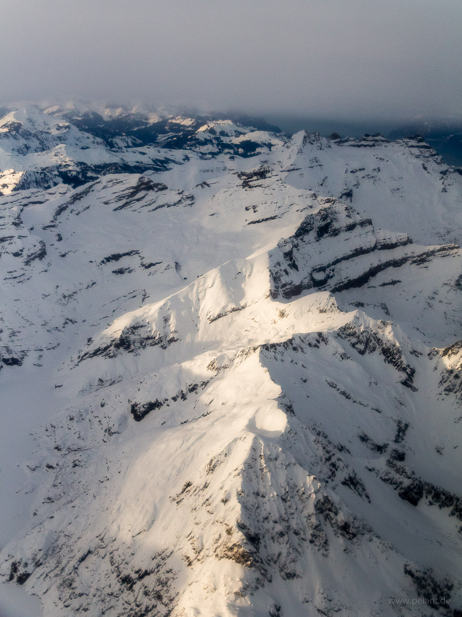 aerial view of snow covered mountains in the Chablais Alps