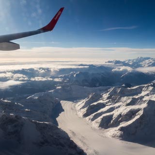 Aerial view of the Aletsch Glacier in the Bernese Alps with the Matterhorn and the Monte Rosa massif at the horizon