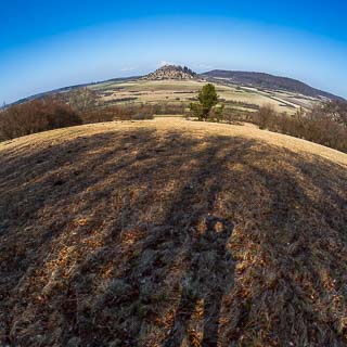 fisheye lens view of the Kornbhl hill with photographers shadow