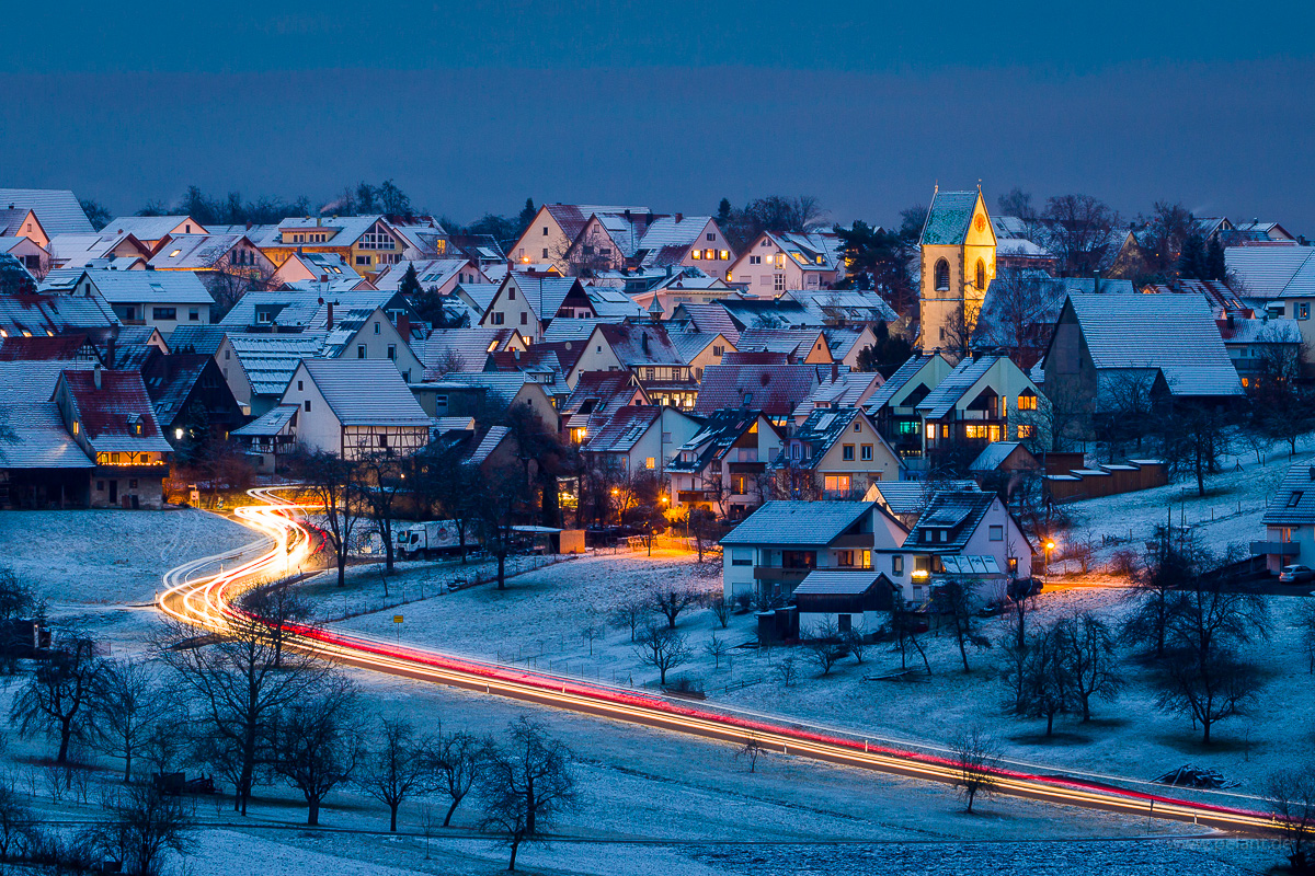 Schlaitdorf at dusk in winter with snow