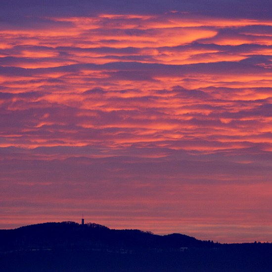 afterglow with silhouette of Schwäbische Alb mountains and Roßbergturm